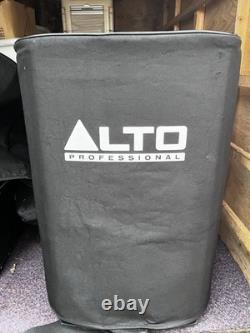 A pair of Alto TS215 15 Powered Active 1100w DJ PA Speakers with covers