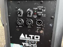 A pair of Alto TS215 15 Powered Active 1100w DJ PA Speakers with covers