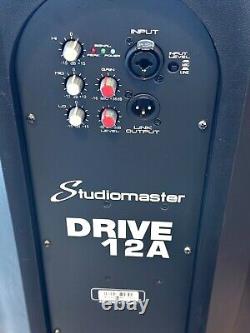 Pair of Studiomaster Drive 12a powered speakers and stands. Collection Only